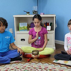 circle of students meditating